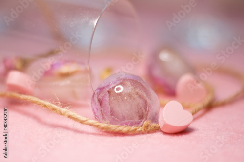  mothers Day. Background for Valentine's Day. Spring background. Glasses and frozen roses. Pink heart