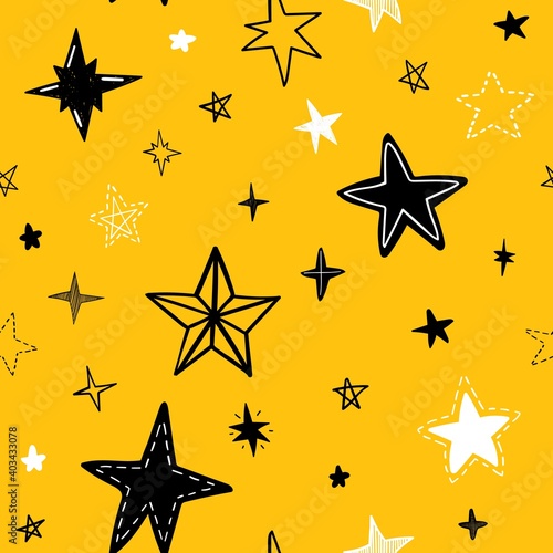 Seamless vector pattern with doodle stars on yellow background