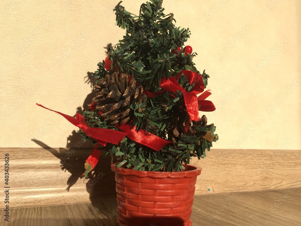 Fototapeta premium christmas tree with red ribbon