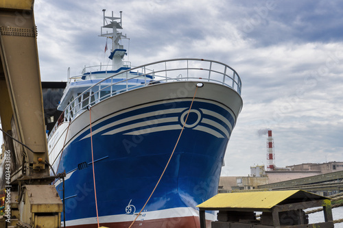 big oceanic fishing boat in a harbour photo