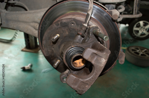 Car wheel brake caliper with traces of corrosion on the piston