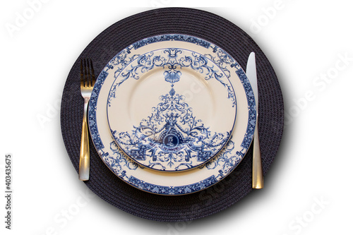 Empty plate on the table, with a colonial style print
