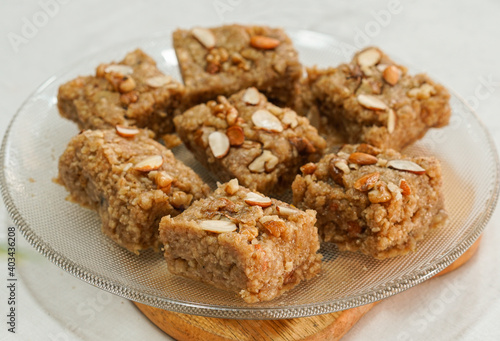 famous pakistani halwa sweet Pieces of sohan halwa in a plate