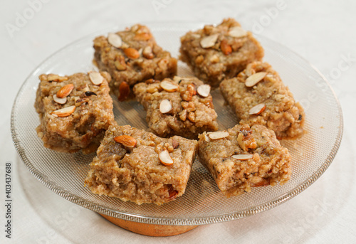 pakistani famous sweet Pieces of sohan halwa in a plate.