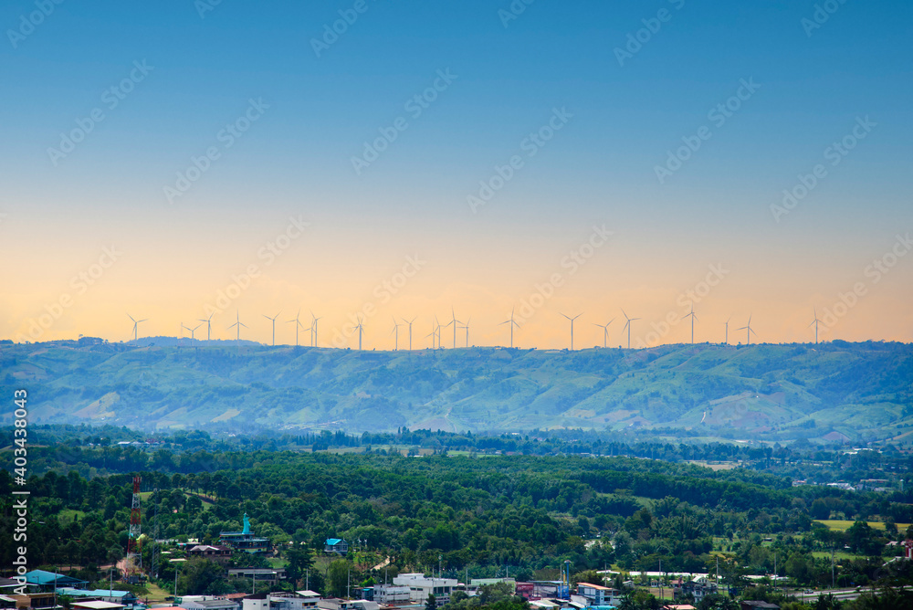 Wind turbines on beautiful sunny summer autumn mountain landsape