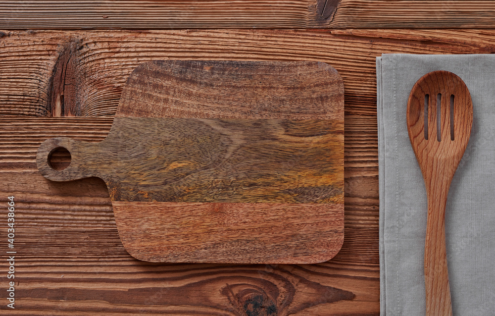 Cutting board, table cloth and wooden spoon
