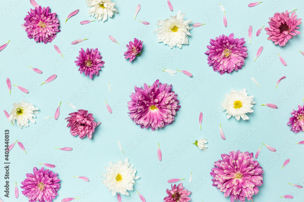 Pattern made of colorful flowers on pastel blue background Pattern made of colorful flowers on pastel blue background