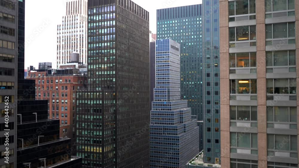 Day Time Tilt-Up View of Skyscraper Buildings from the 19th Floor in New York City Day Time Tilt-Up View of Skyscraper Buildings from the 19th Floor in New York City
