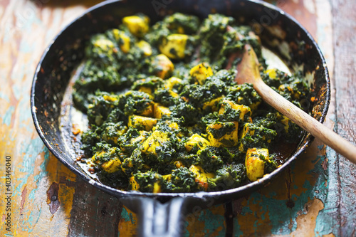 Картината върху платно Saag paneer - fried cheese with turmeric and spinach garam masala