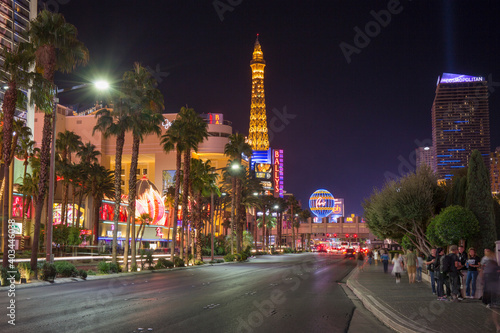 View along The Strip by night, illuminated Eiffel Tower at the Paris Hotel and Casino prominent, Las Vegas, Nevada, United States of America, North America photo