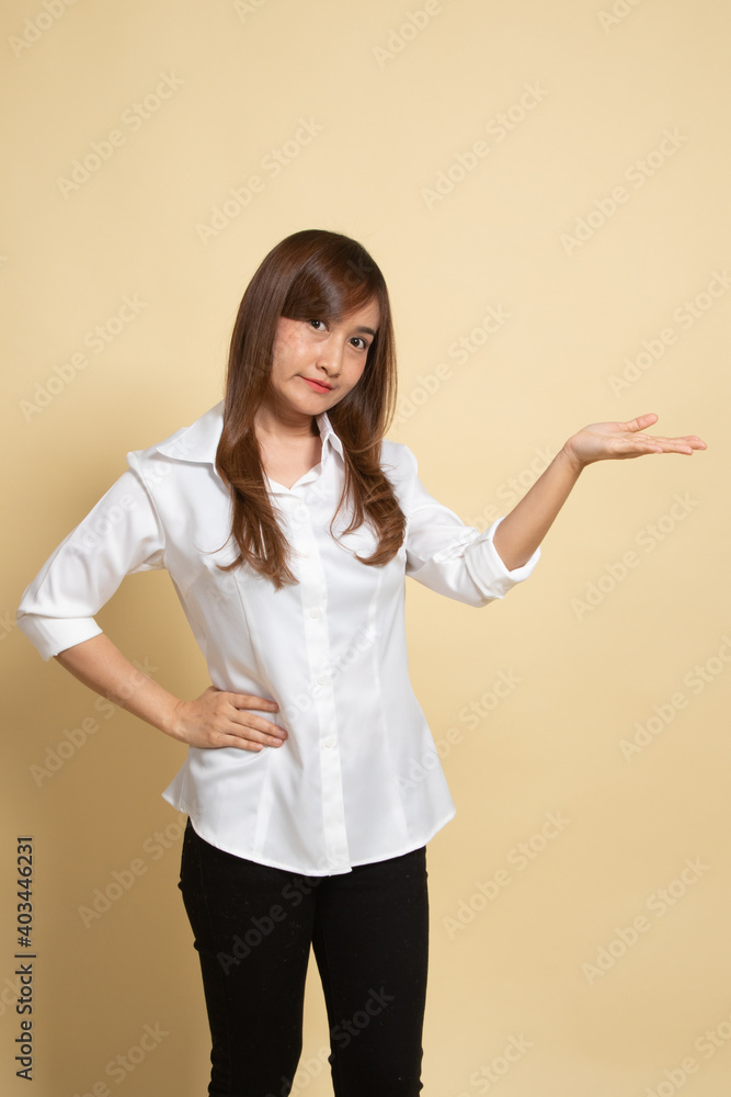 Young Asian woman present with her hand. Young Asian woman present with her hand.