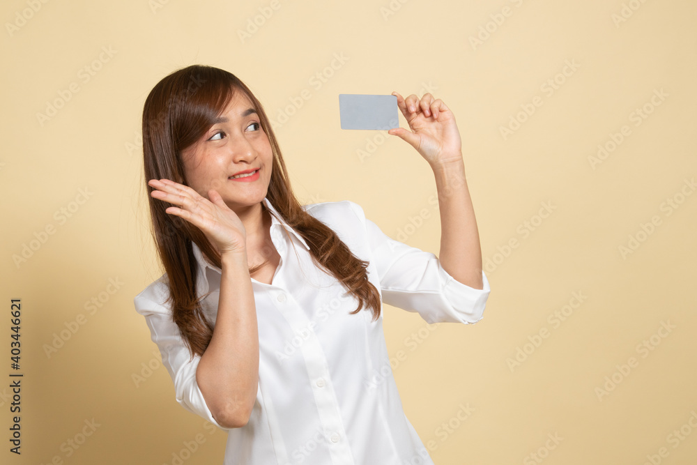 Young Asian woman happy with blank card. Young Asian woman happy with blank card.