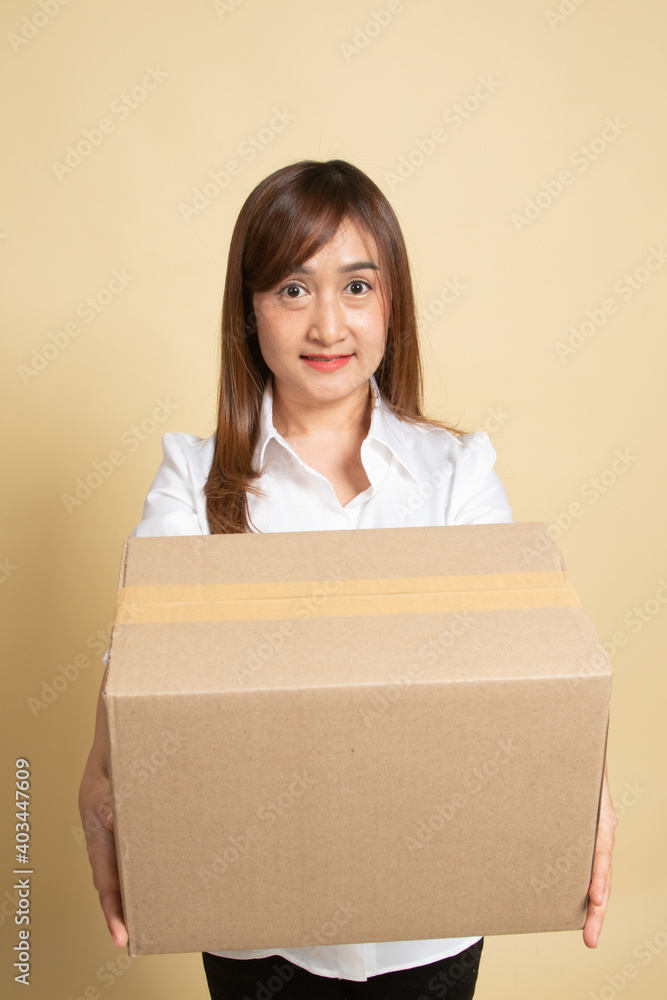 Delivery, relocation and unpacking. young asian woman holding cardboard box. Delivery, relocation and unpacking. young asian woman holding cardboard box.
