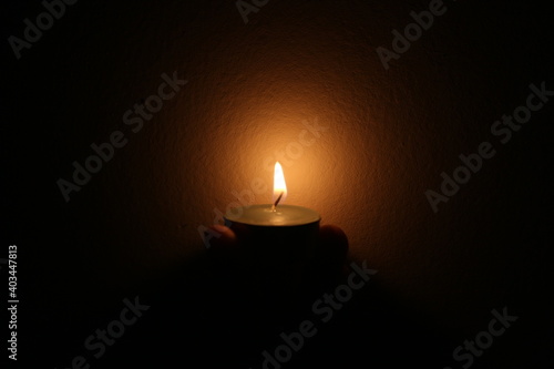 The candlelight in the dark room