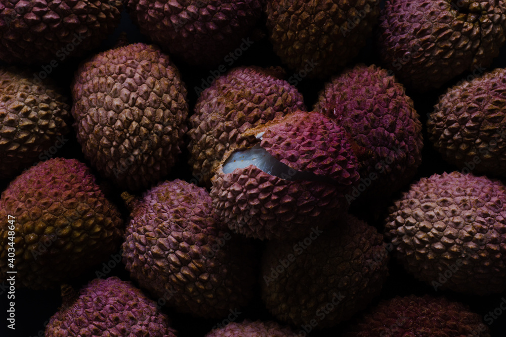 Close up of open lychee fruit on top of lychees; full frame Close up of open lychee fruit on top of lychees; full frame
