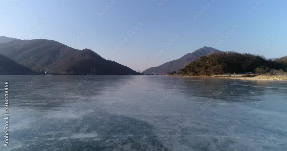 drone shot of lake frozend in winter what Paldang lake with mountains in Korea drone shot of lake frozend in winter what Paldang lake with mountains in Korea