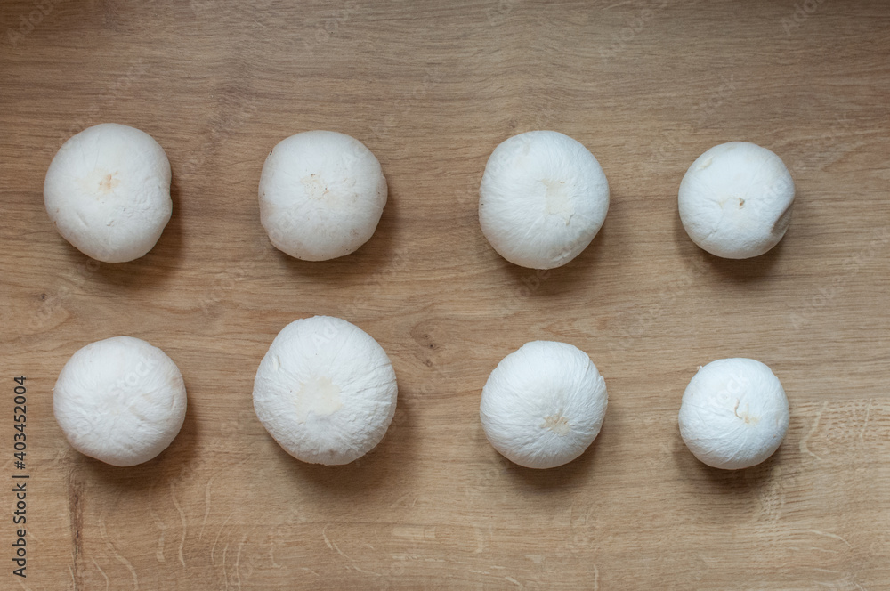 Champignons at wooden background Champignons at wooden background