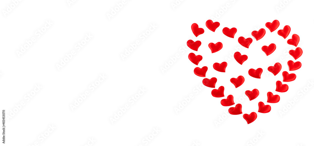 Valentine's Day greeting card. Heart shape of small red hearts on a white background. Flat lay, top view, copy space. Banner. Valentine's Day greeting card. Heart shape of small red hearts on a white background. Flat lay, top view, copy space. Banner.