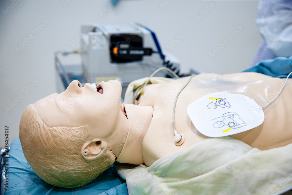 AED pad on chest of dummy patient for CPR training, first aid training