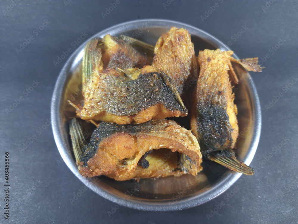 Tasty and spicy fish fry from Indian Food. Tasty baked fish on plate