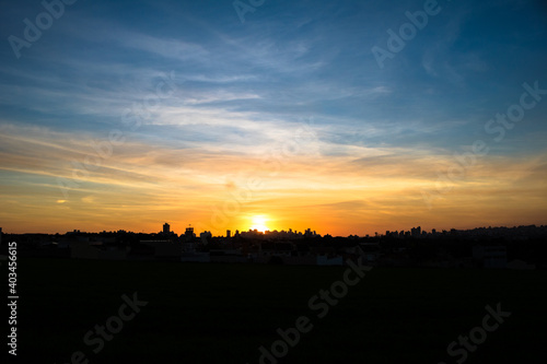 Photos of the sunset at the end of the day with the outline of the buildings in londrina  parana  brazil