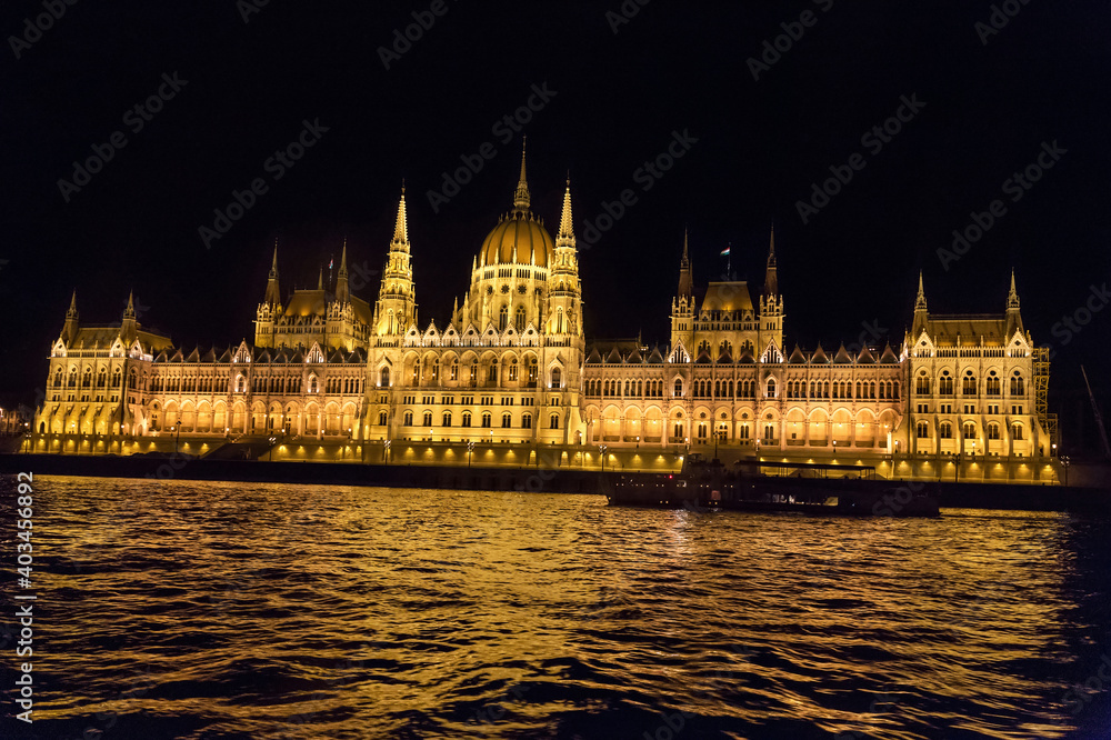 Night view of the most beautiful building of the Hungarian Parliament from the Danube River. City of Budapest, Hungary, night.