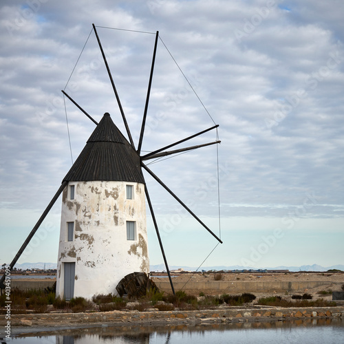 Historic windmill in the salt lakes in San Pedro del Pinatar, Murcia, Spain. Spanish name: Molino de Quintín.