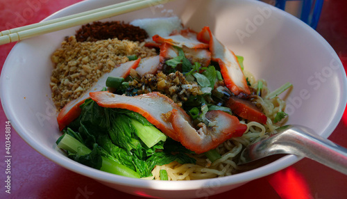 Dry red pork noodles. Yello...
