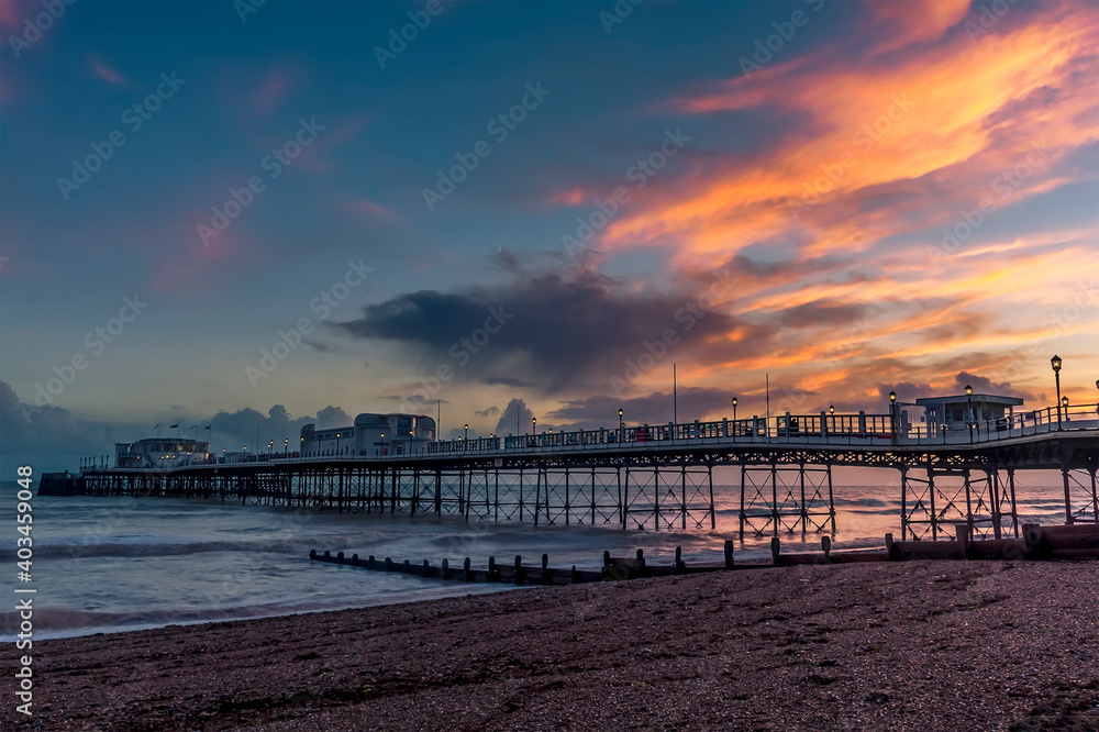 A view along the pier at Worthing, Sussex at sunset
