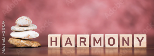 Balance stones with harmony text letter cubes. Panoramic web banner.