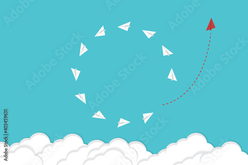 Think differently. Red airplane changing direction. New idea, change, trend, courage, creative solution, innovation and unique way concept.	