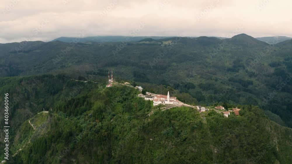 Monserrate hill in Bogota, Colombia, aerial view drone footage. Popular touristic place for scenic views over the capital city from this high vantage point lookout Monserrate hill in Bogota, Colombia, aerial view drone footage. Popular touristic place for scenic views over the capital city from this high vantage point lookout