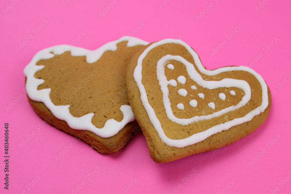 Gingerbread cookies hearts on pink background Gingerbread cookies hearts on pink background