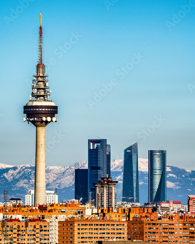 Photography Skyline of Madrid city, with snowy mountains background