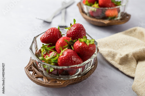 Strawberries in vintage bowls. A delicious summer snack.