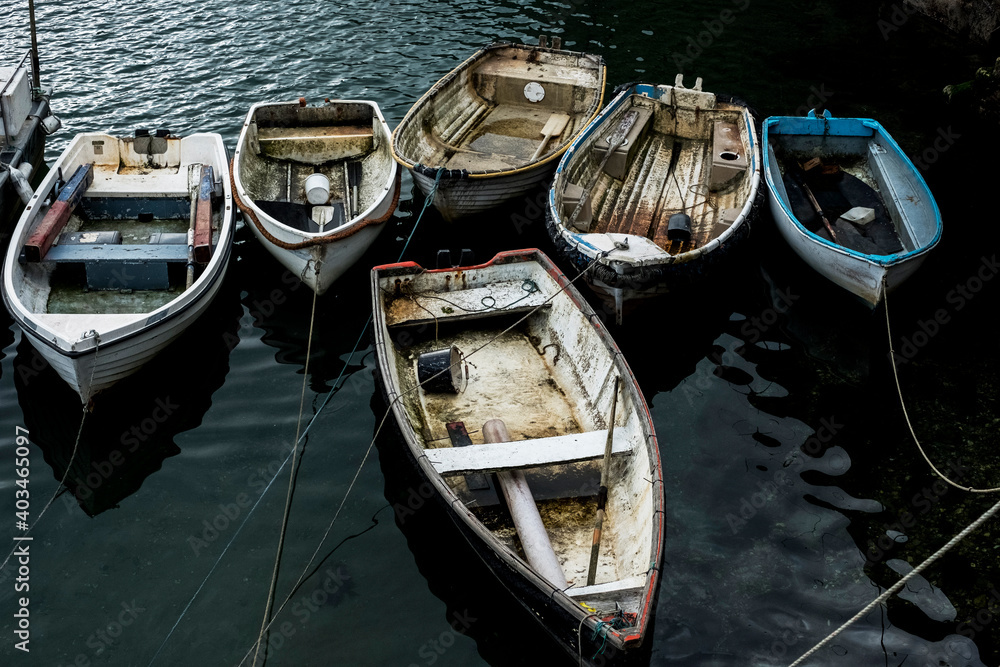 High angle view of fishing boats moored in harbour. High angle view of fishing boats moored in harbour.