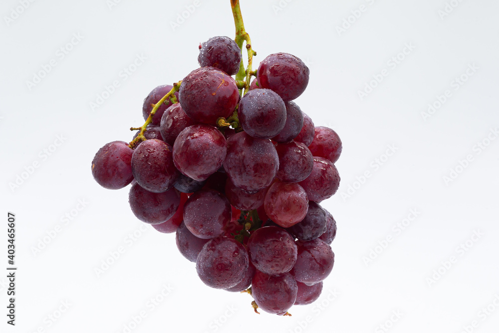 Bunch of red grapes on white background