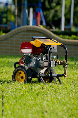 Motor pump on the lawn. Plumbing Tools. Everything for cleaning the sewer.