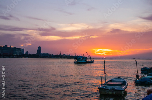 an old ship during the sunset on the sea in the Gulf of Thailand