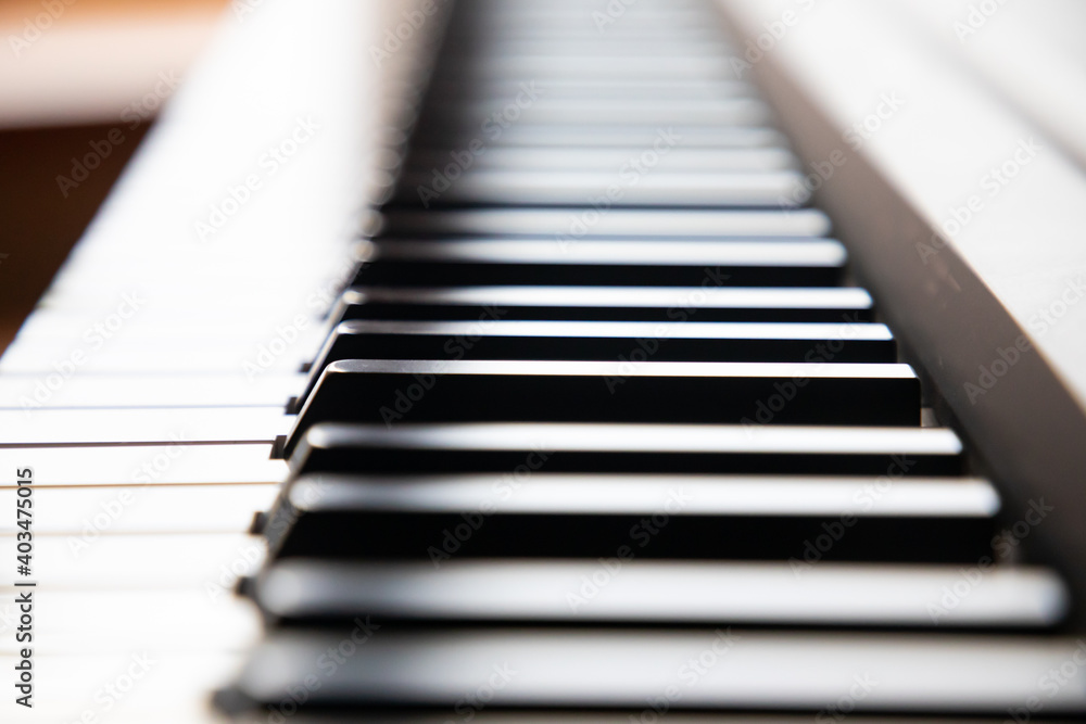 Close up of piano keys at day light, in black and white colors