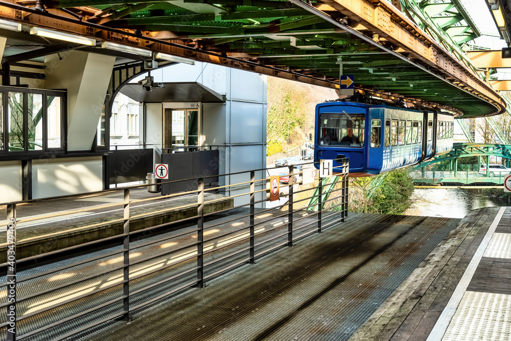 Wuppertal's suspension railway arrives at the station. Wuppertal, Germany