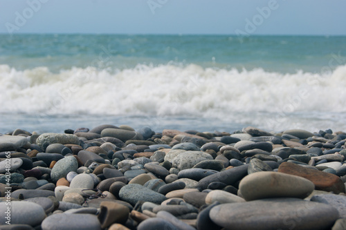 A small storm three or four points at sea, the wave hits the shore with a large pebble. Black Sea, summer vacation vacation beach travel