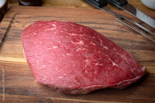 Bilde på lerret raw flank steak on wooden cutting board