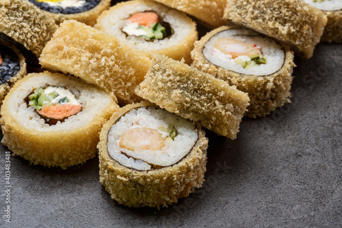 Set hot sushi roll with shrimp, snow crab, salmon, Philadelphia cheese and tempura