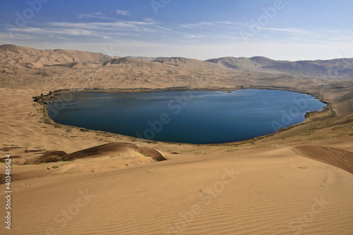 Full Nuoertu lake-view from western megadune-Badain Jaran desert. Inner Mongolia-China-1190