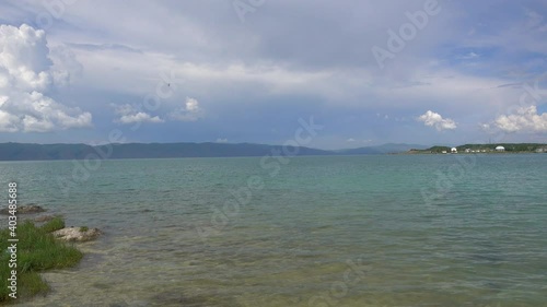 Beautiful Sevan lake in Armenia on Mountains and Clouds background. 