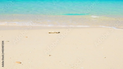 beautiful beach and clear waves in Okinawa Kurima island Nagama beach photo