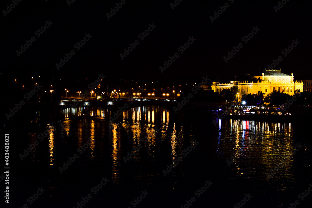 Reflection of a city on water surface in night Reflection of a city on water surface in night