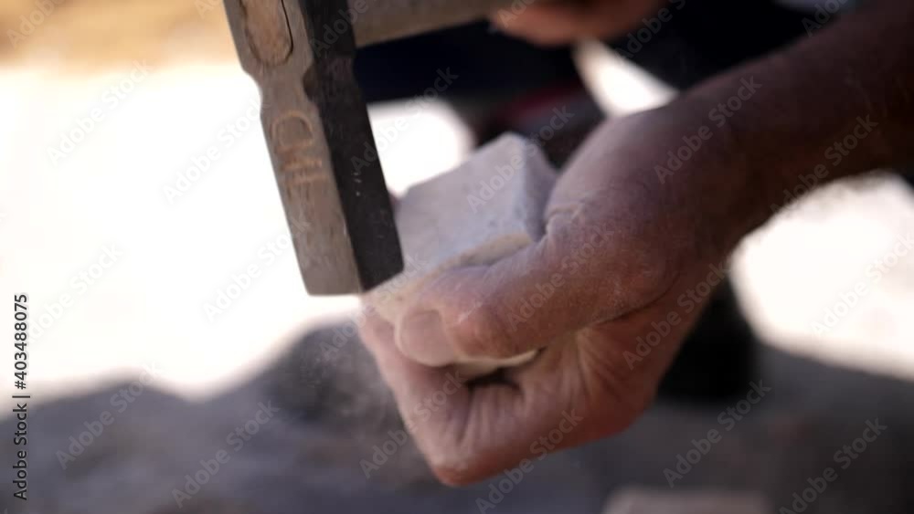 paver working on traditional portuguese cobblestone pavement slow motion paver working on traditional portuguese cobblestone pavement slow motion