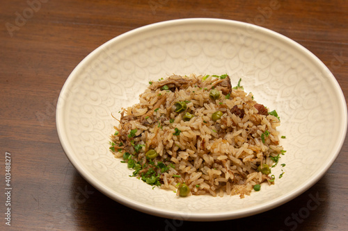 Duck rice with peas and spices